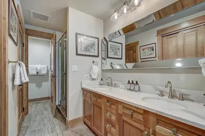 a bathroom with two sinks and a shower at Premier 1 Bedroom Ski In, Ski Out Lone Eagle Condo With The Best Access To Skiing In Keystone in Keystone