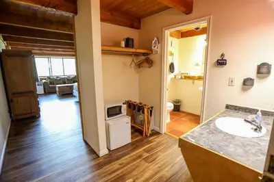 a bathroom with a sink and a counter top at The Boulder Creek Lodge in Nederland
