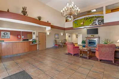 a lobby of a hospital with chairs and a waiting room at Quality Inn & Suites Wellington - Fort Collins in Wellington