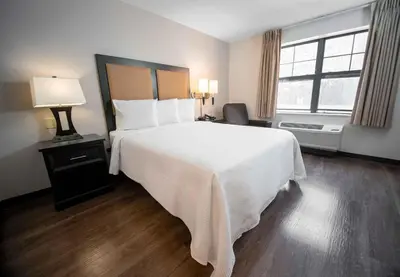 a bedroom with a large white bed and a window at Extended Stay America Suites - Denver - Westminster in Westminster