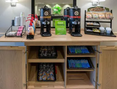 a counter with food and drinks on it at Extended Stay America Suites - Denver - Westminster in Westminster