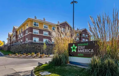 a sign in front of a building with a stay america sign at Extended Stay America Suites - Denver - Westminster in Westminster