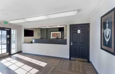 an empty office with a reception desk and a door at Extended Stay America Select Suites - Denver - Cherry Creek in Denver
