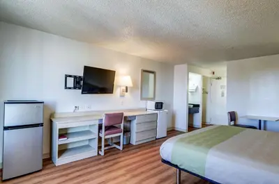 a hotel room with a bed and a desk at Motel 6-Greenwood Village, CO - Denver - South Tech Center in Greenwood Village