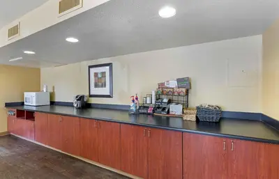 a restaurant counter with a black counter top at Extended Stay America Suites - Denver - Aurora North in Aurora