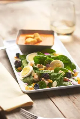 a plate of food with a salad on a table at Hyatt House Denver Tech Center in Centennial