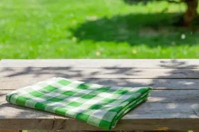 a green and white napkin sitting on a wooden table at Extended Stay America Select Suites - Denver - Tech Center - Central in Greenwood Village