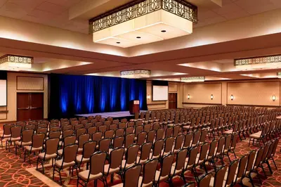 an empty lecture hall with chairs and a stage at Sheraton Hotel Denver Tech Center in Greenwood Village