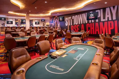 a poker room with poker tables and chairs at Horseshoe Black Hawk, A Caesars Destination in Black Hawk