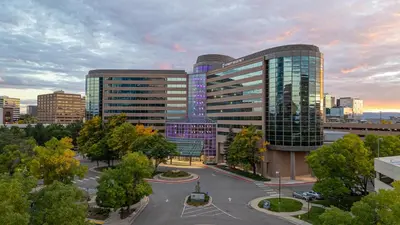 a large building in a city with a parking lot at Hyatt Regency Denver Tech Center in Denver