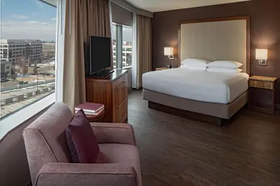 a hotel room with a bed and a large window at Hyatt Regency Denver Tech Center in Denver