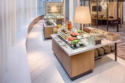 a buffet line in a hotel lobby with food at Hyatt Regency Denver Tech Center in Denver