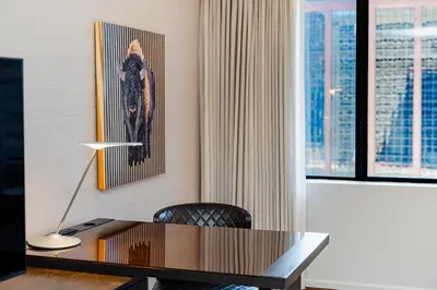 a desk in a room with a picture on the wall at Grand Hyatt Denver in Denver