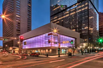 a building with purple lighting on the side of a street at Grand Hyatt Denver in Denver