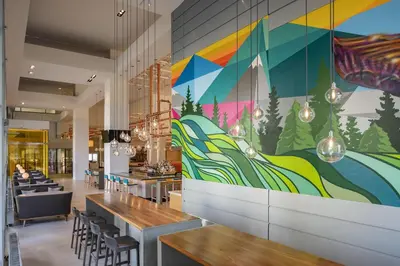 a colorful mural on the wall of a restaurant at Hyatt Regency Denver at Colorado Convention Center in Denver