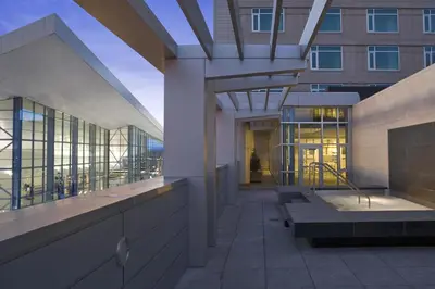 a lobby of a building with benches in front at Hyatt Regency Denver at Colorado Convention Center in Denver