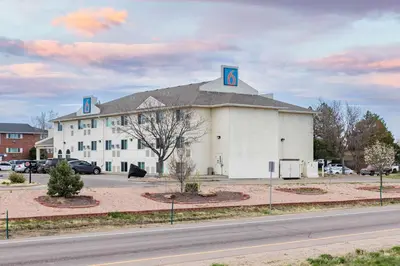 a large white building with the number on it at Motel 6-Fort Lupton, CO in Fort Lupton