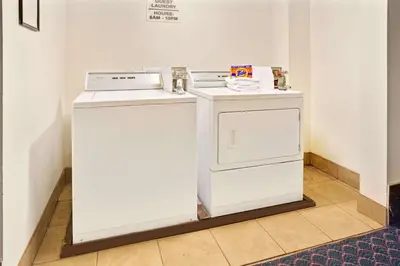 two appliances sitting next to each other in a room at Super 8 by Wyndham Longmont/Del Camino in Longmont