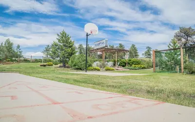 a basketball court with a basketball hoop in a park at Blue Door Inn in Estes Park