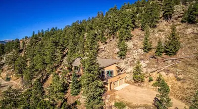 an aerial view of a house on a mountain at The Cedars Luxury Home At Windcliff Home in Estes Park