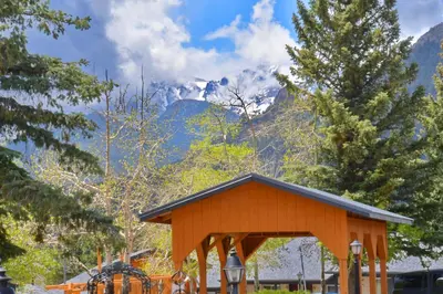 a gazebo with mountains in the background at Murphy's Resort in Estes Park