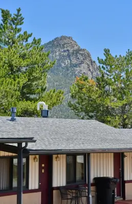 a house with a mountain in the background at Murphy's Resort in Estes Park