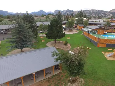 an aerial view of a resort with a pool and trees at Murphy's Resort in Estes Park