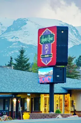 a sign for a restaurant in front of a mountain at Murphy's Resort in Estes Park