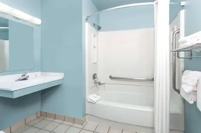 a bathroom with a tub and a toilet and a sink at Super 8 by Wyndham Dillon/Breckenridge Area in Dillon
