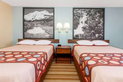 a hotel room with two beds and a mountain at Super 8 by Wyndham Dillon/Breckenridge Area in Dillon
