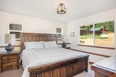 a bedroom with a large bed and a window at Hawkeye Ridge in Estes Park