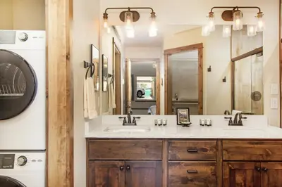 a bathroom with a sink and a mirror at Hawkeye Ridge in Estes Park