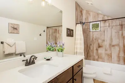 a bathroom with a sink and a toilet and a shower at Hawkeye Ridge in Estes Park