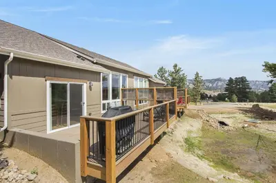 a porch of a house with a building at Hawkeye Ridge in Estes Park