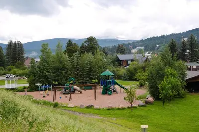 a park with a playground with a slide at Nederland Getaway Home in Nederland