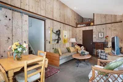 a living room with a couch and a table at Deering Crest in Estes Park