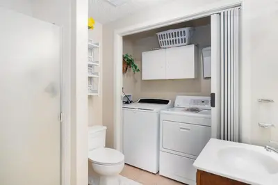 a small white bathroom with a sink and a toilet at Deering Crest in Estes Park