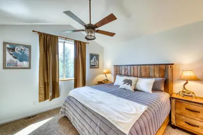 a bedroom with a bed and a ceiling fan at Aspen Glen 80 in Silverthorne