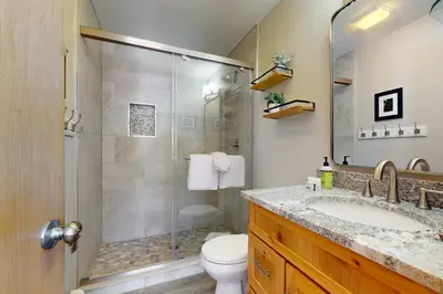 a bathroom with a shower and a sink and a toilet at Watch Hill 216 in Silverthorne