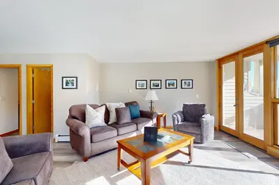 a living room with a couch and two chairs and a table at Watch Hill 216 in Silverthorne