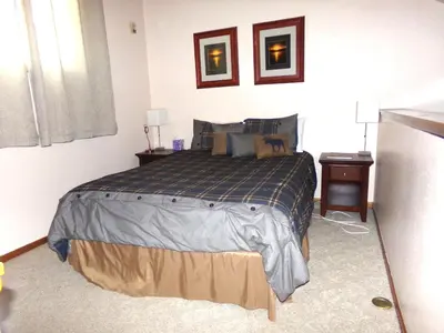 a bedroom with a bed and two night stands at Buffalo Ridge 2 Bedrooms 1 Loft BRBF in Silverthorne