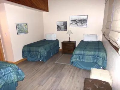 a hotel room with two beds and a lamp at Buffalo Ridge 2 Bedrooms 1 Loft BRBF in Silverthorne