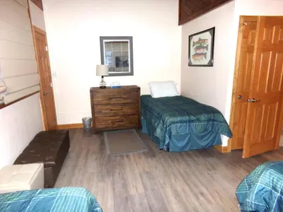 a bedroom with two beds and a wooden floor at Buffalo Ridge 2 Bedrooms 1 Loft BRBF in Silverthorne