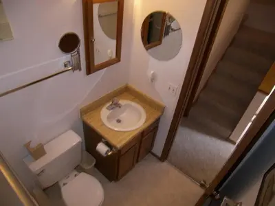 a bathroom with a sink and a toilet and a mirror at Buffalo Ridge 2 Bedrooms 1 Loft BRBF in Silverthorne