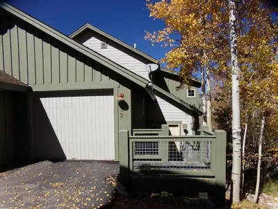 a house with a garage with a dog in it at Anemone Townhome 3 bed 3 bath HTAT in Silverthorne