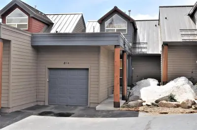 a house with a garage in front of it at Forest Park 3 bed 4 Bath Twnhm HTJM in Silverthorne