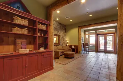 a living room with a couch and a table at Arapahoe Lodge 1 Bed 1 Bath ALJP in Keystone