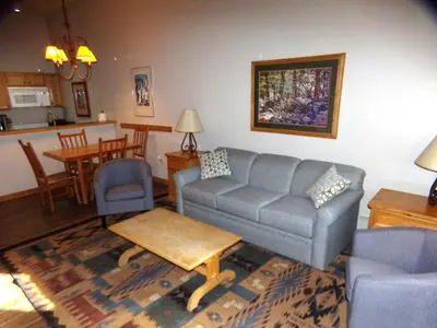 a living room with a couch and a table at Arapahoe Lodge 1 Bed 1 Bath ALJP in Keystone