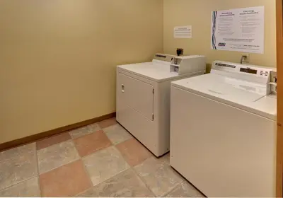 a small laundry room with a washer and dryer at Arapahoe Lodge 1 Bed 1 Bath ALJP in Keystone