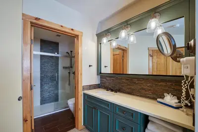 a bathroom with a sink and a mirror at Buffalo Lodge 3 Bed 3 Bath BLCD3 in Keystone